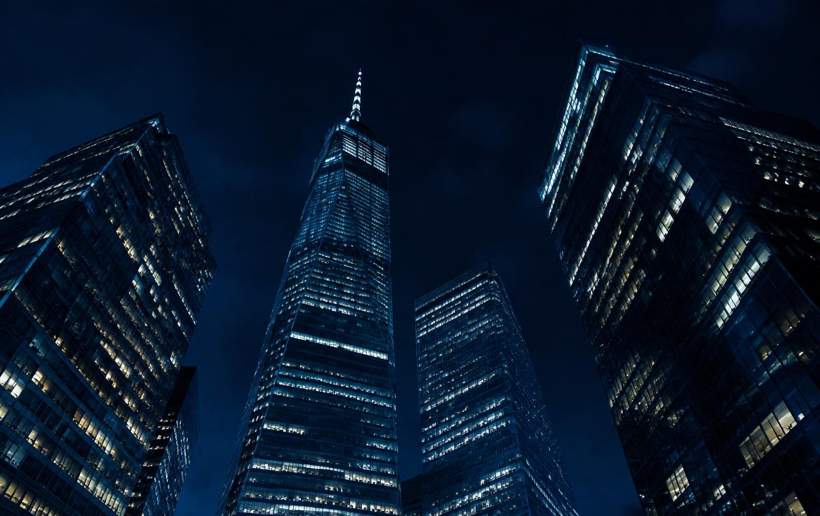 Lower Manhattan skyscrapers seen from street level at night
